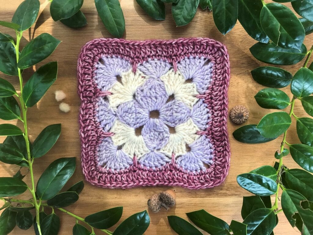 three color purple and white crochet square