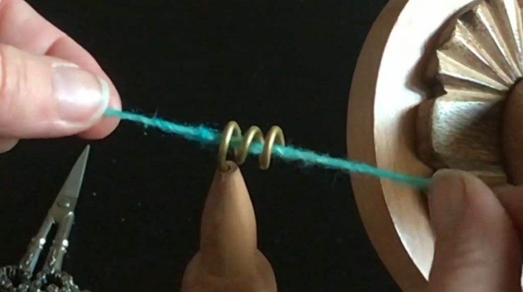 Twist yarn into spiral holder